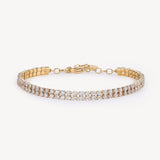 305 stainless steel tennis bracelet, 14K gold pvd coating with clear cubic zirconia.|BEI097
