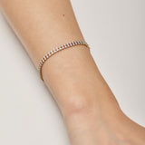 305 stainless steel tennis bracelet, 14K gold pvd coating with clear cubic zirconia.|BEI097