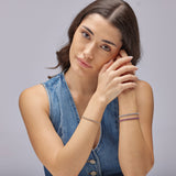 305 stainless steel tennis bracelet, 14K gold pvd coating with clear cubic zirconia.|BEI097