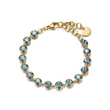316L stainless steel bracelet and 14K gold pvd coating and smoked sapphire color crystals.